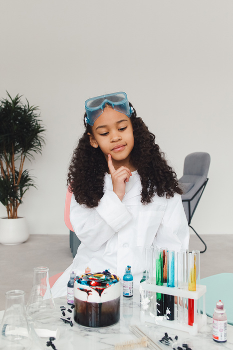 Girl Doing Science Experiment with Dyes